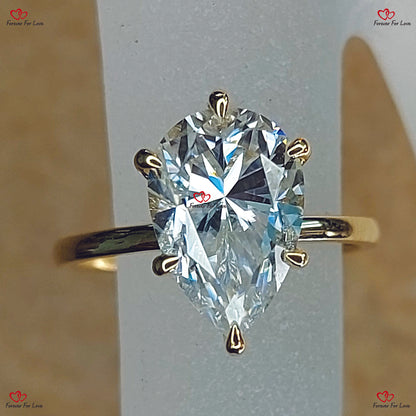 Celebrity Charm  Pear Shaped Moissanite Engagement Ring