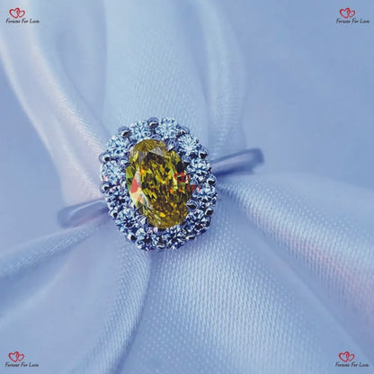 Bague de fiançailles avec diamant taille ovale jaune fantaisie et halo