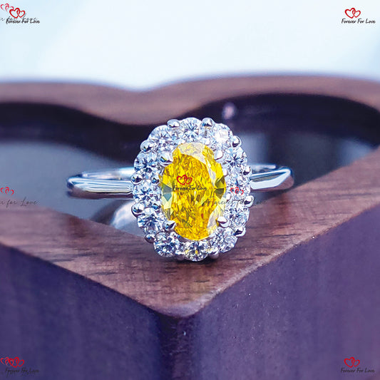 Bague de fiançailles avec diamant taille ovale jaune fantaisie et halo